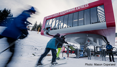 Skiers heading to the new Fitzsimmons 8-person chairlift at Whistler Blackcomb in British Columbia Canada