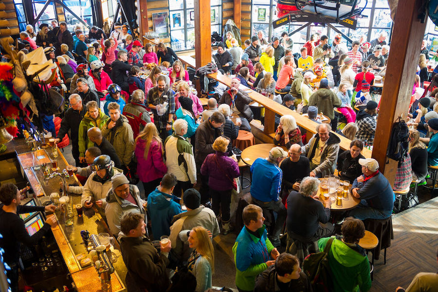 A crowded bar during apres after a day of skiing at Whistler Blackcomb.
