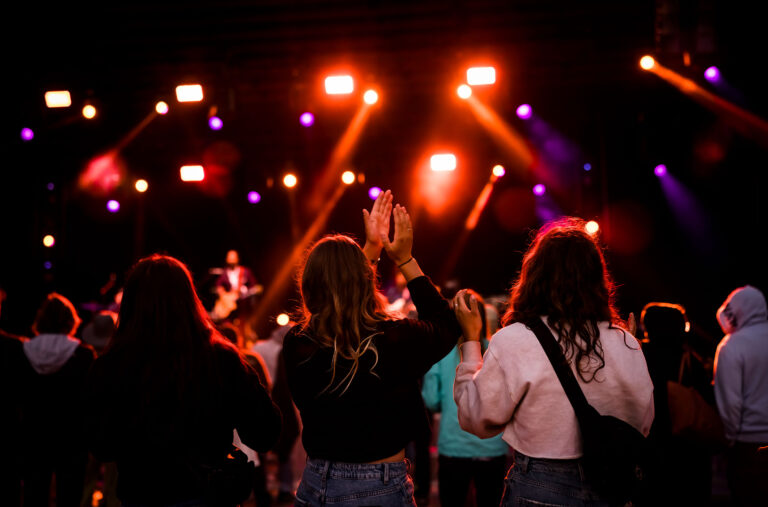 A group of friends dancing on a night out in Whistler.