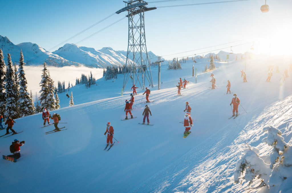 Skiers dressed like Santa make their way down the slopes of Whistler Blackcomb on "Dress Like Santa Day".