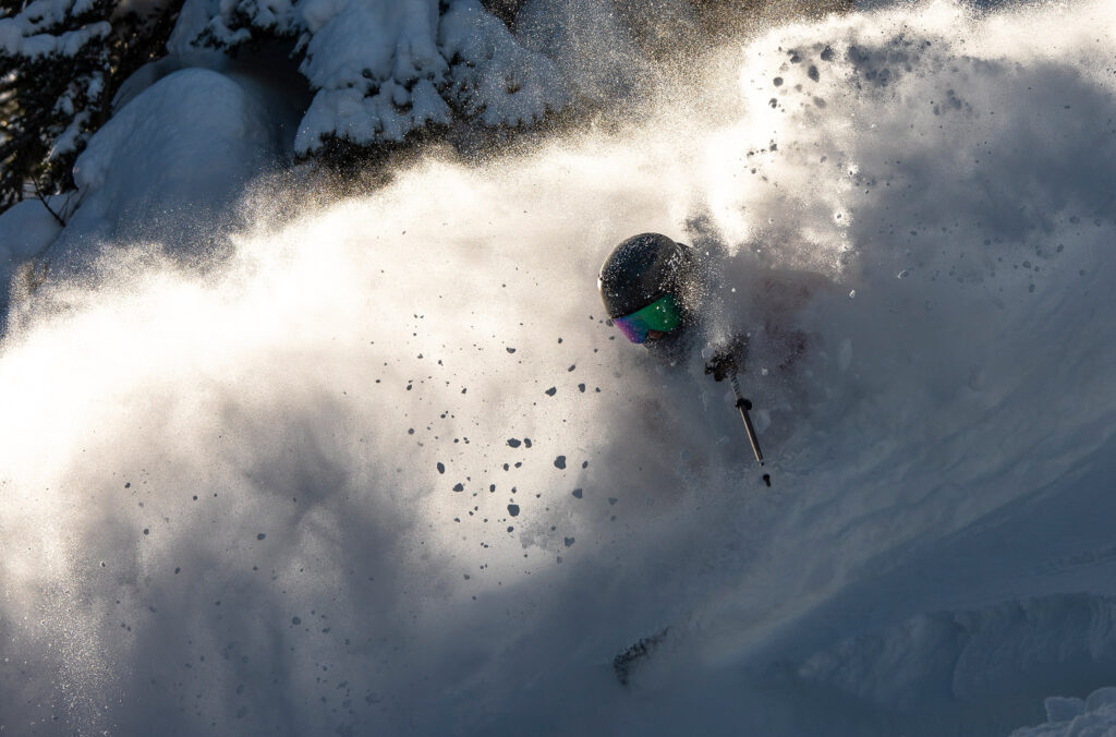 A skier is hardly visible in the Whistler powder as they charge down the slope at Whistler Blackcomb.