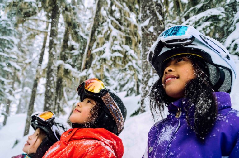 Three children admiring the sno.