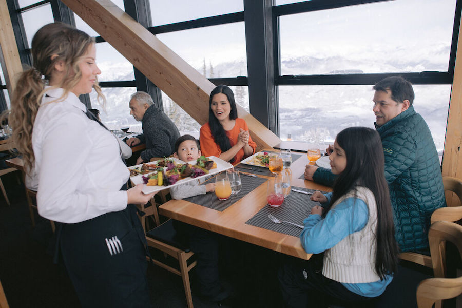 A family enjoys fine dining luxury at Christine's restaurant in Whistler. 