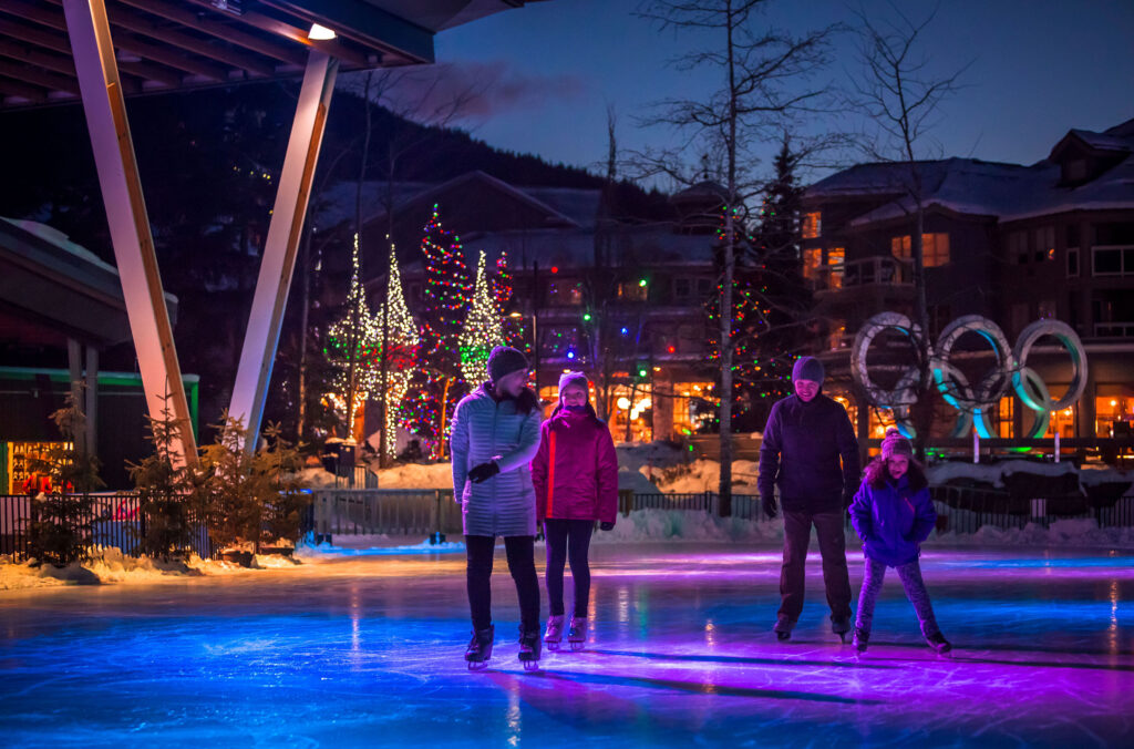 A family skates on the ice at Whistler's Olympic Plaza.