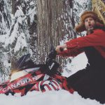 Canadiana Man Snowmobiling in Whistler