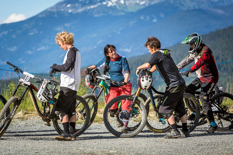 Mountain bikers socializing at the top of the trail