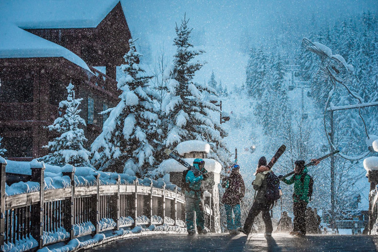 Skiiers in Whistler Creekside during a snow storm