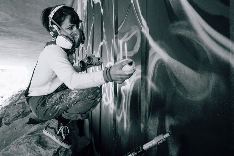 Artist Jessa Gilbert Painting the Creekside Underpass Mural