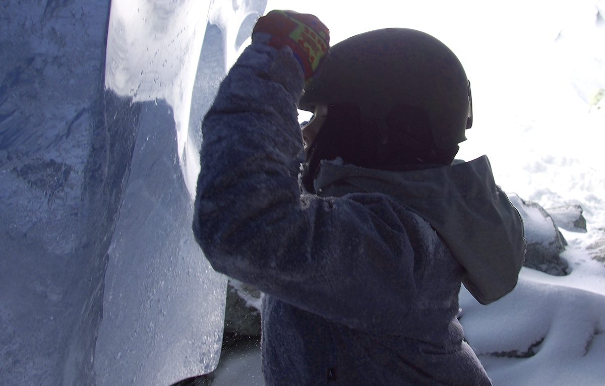 Kid Looks into Ice Cave Wall near Whistler