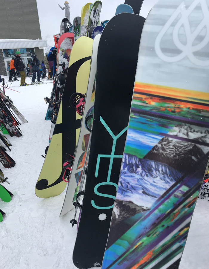 Snowboards on the rack on Whistler Mountain.