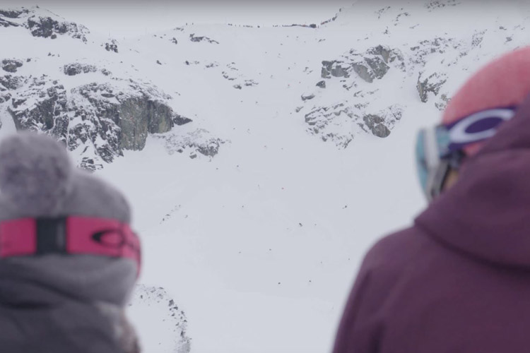 Spectators watch the Saudan Couloir Ski Race Extreme in Whistler BC