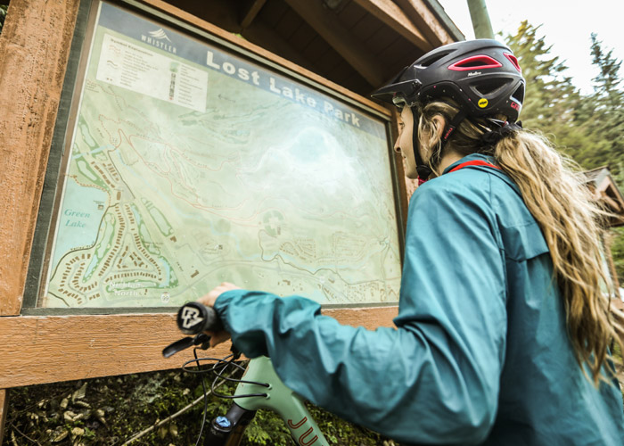 Looking at the trail map at Lost lake.