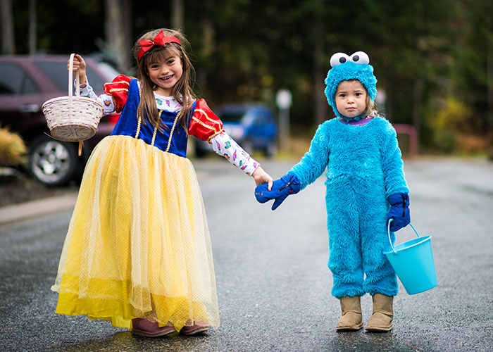 Two children are dressed up for Halloween trick-or-treating in Whistler.