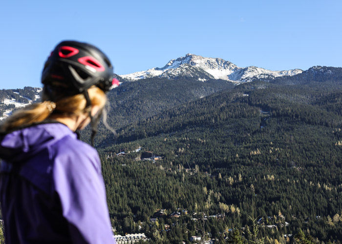 A mountain biker admires the views over Whistler Mountain from the Westside trails.