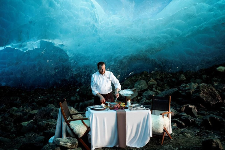 A chef prepares dinner in an ice cave during Whistler's Cornucopia festival.