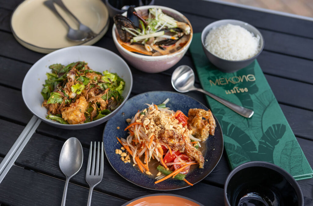 A table laid with colourful Thai food at Mekong restaurant in Whistler.