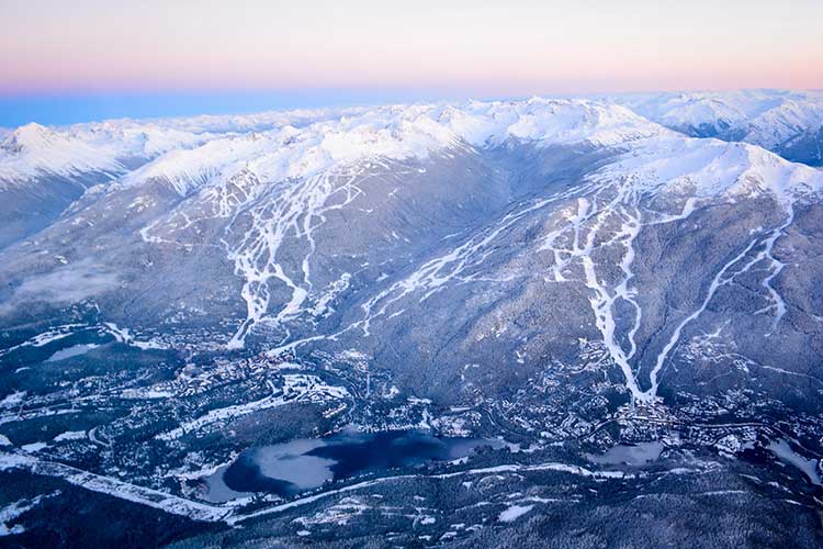 aerial shot of Whistler and Blackcomb mountains at sunset