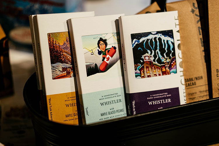A selection of Whistler chocolates with fun artwork packaging.