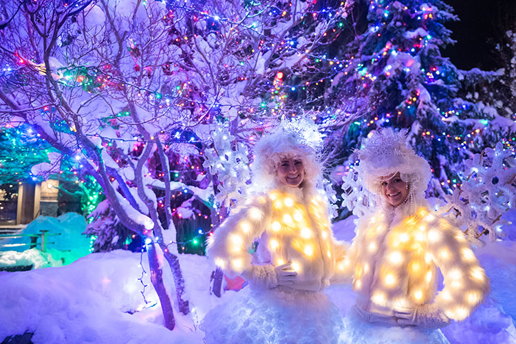 Festive characters pose under the lights in Whistler.