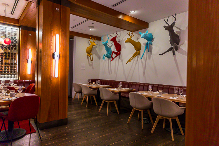 Art work of running deer adorn the walls at the Aura restaurant.