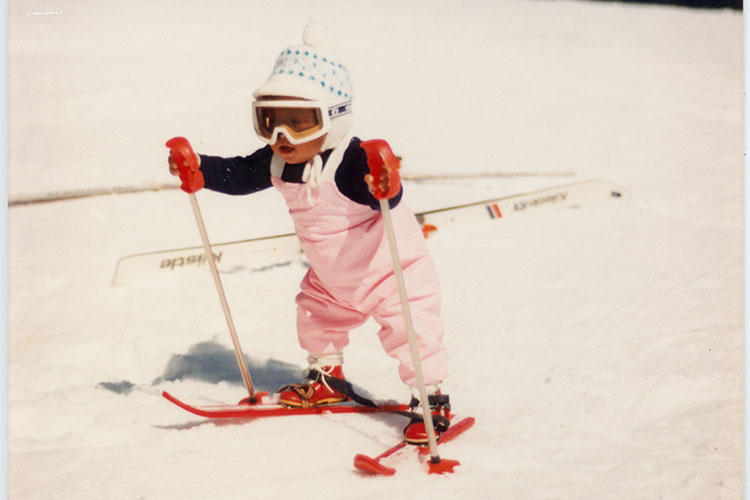 A tot skier in a pink outfit takes to the slopes in Whistler.