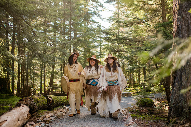 Ambassadors at the SLCC walk through the forest.