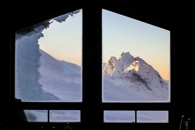Stunning mountain views out of a window.