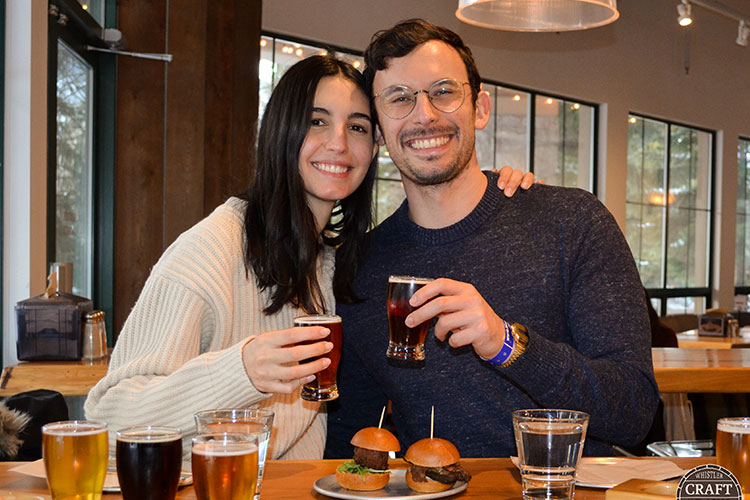 A couple sample beers at Hunter Gather in Whistler.