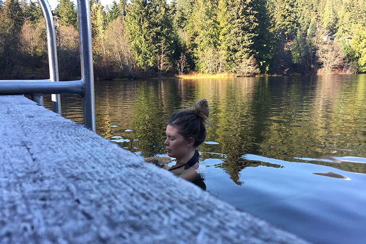 Asta Kovanen takes a deep breath as she descends into the lake. 
