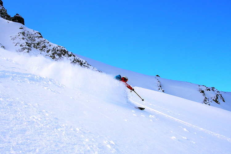 Skiers in powder conditions in Whistler's backcountry