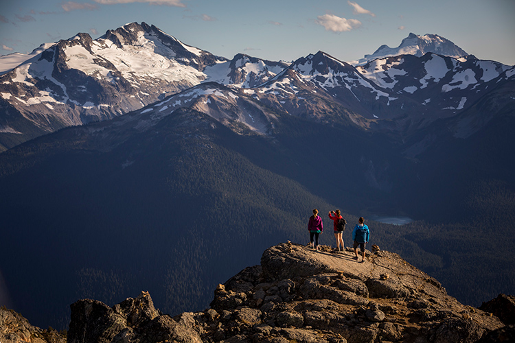 Hikers overlooking a mountain view in Whistler