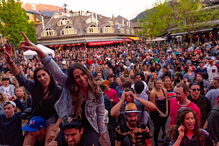 The crowd dancing at an outdoor concert in Whistler
