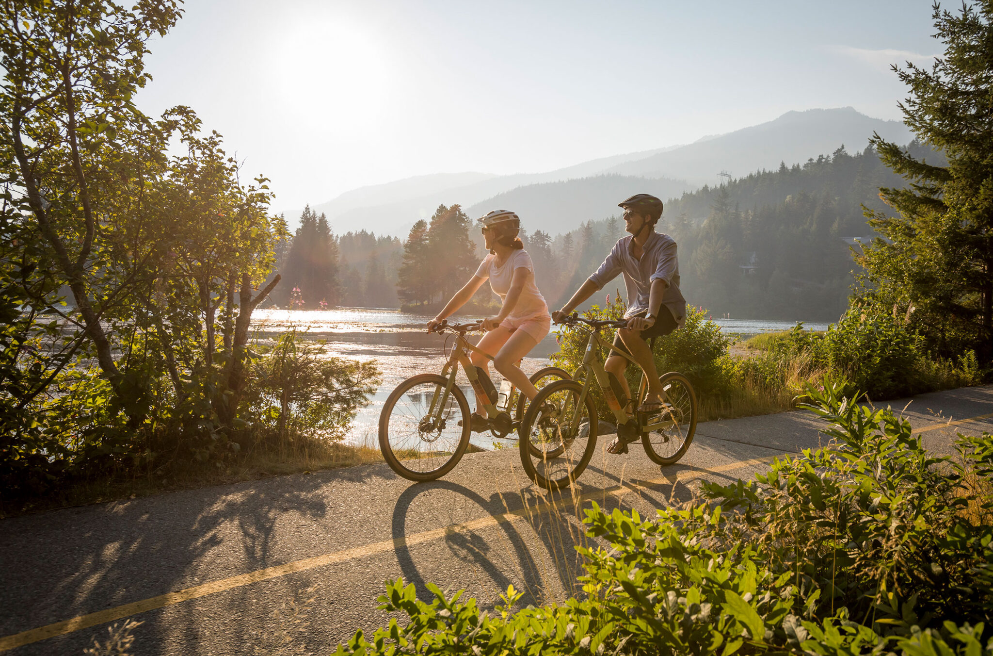 Two bikers ride the Valley Trail in Whistler.