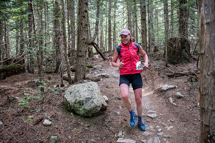 A runner races down a rocky path in the Whistler X Tri.