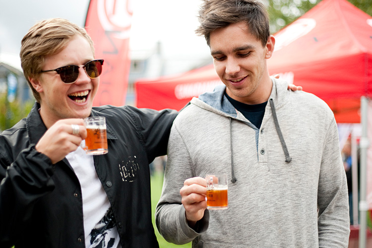 Two friends tasting craft beer in Whistler