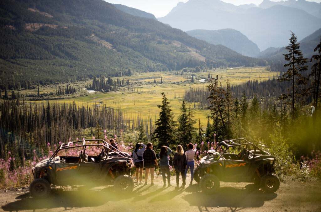 A group ATVing in Whistler stop to admire the views.