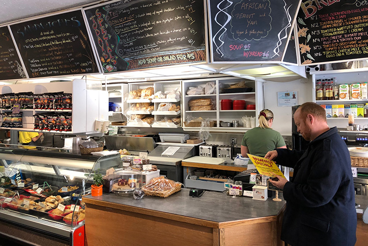 Mayor lookg at the menu at Ingrids in Whistler