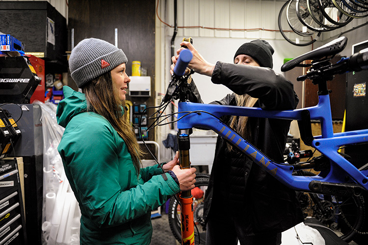 Mechanic re-building a bike in Whistler