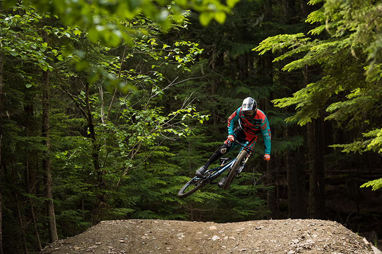 Rider doing a whip in the Whistler Mountain Bike Park