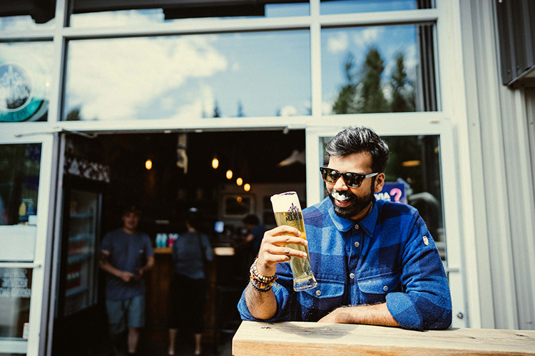 Person drinking a Coast Mountain Brewing ale