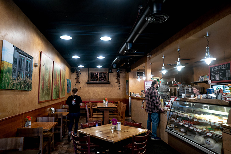 Tables and deli counter at Pasta Lupino