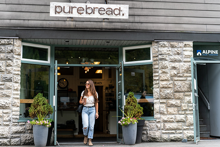 Shopper walking out of Purebread