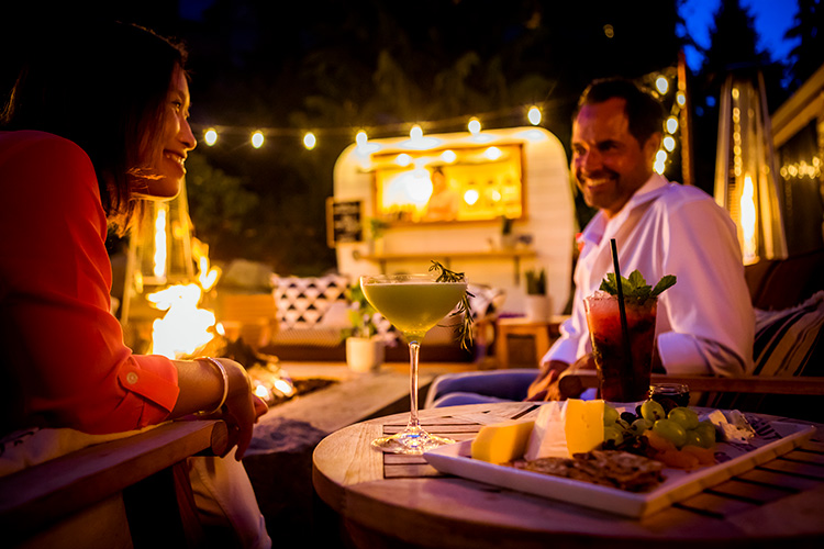 Couple sitting on patio at Four Seasons in Whistler