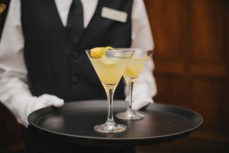 Two martinis on a serving tray