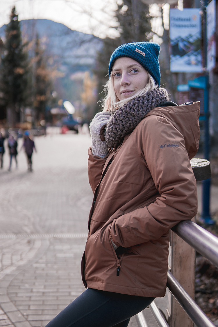 Woman dressed for winter in Whistler Village