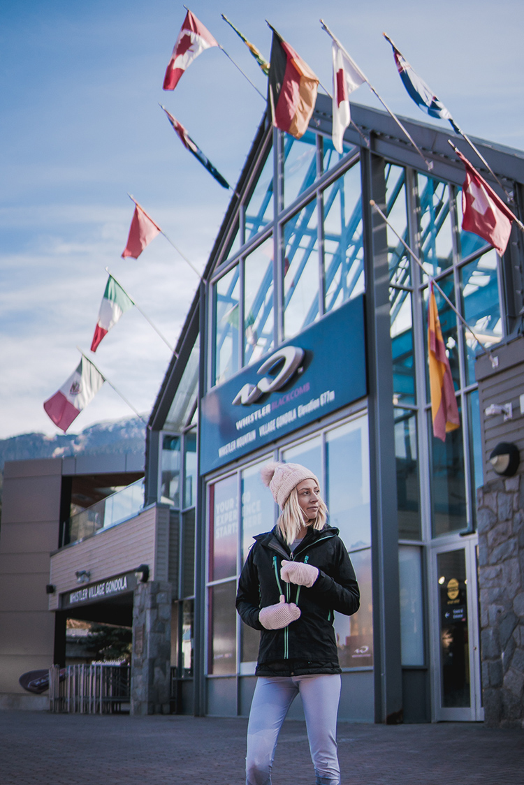 Women wearing a jacket standing in Whistler Village