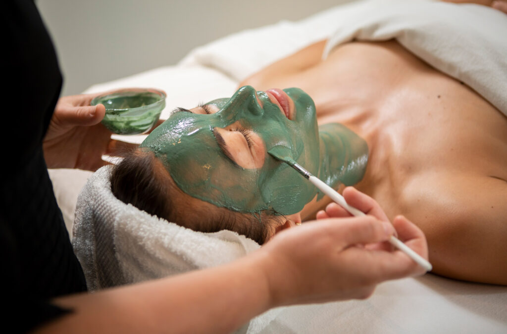 A person enjoys getting a facial at one of Whistler's spas.