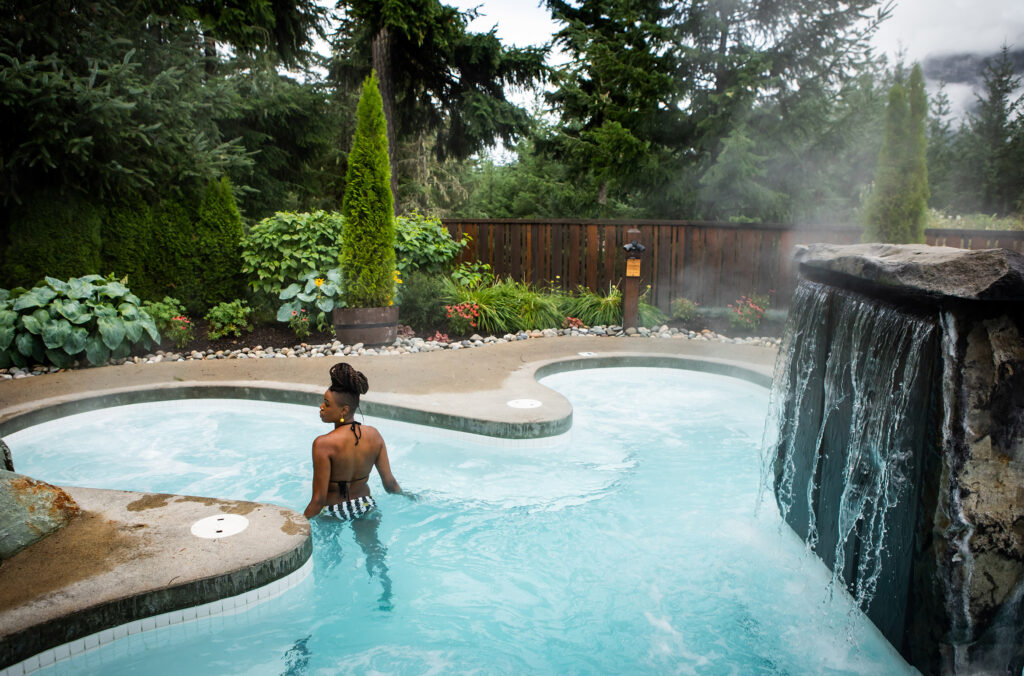 A person takes a leisurely dip in one of the hot pools at the Scandinave Spa in Whistler.