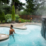 A person takes a leisurely dip in one of the hot pools at the Scandinave Spa in Whistler.