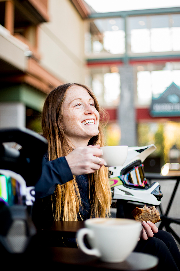 Person drinking coffee on a patio in Whistler